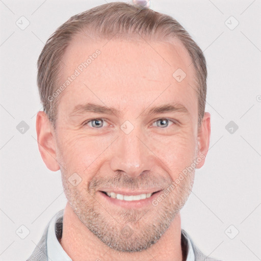 Joyful white adult male with short  brown hair and grey eyes