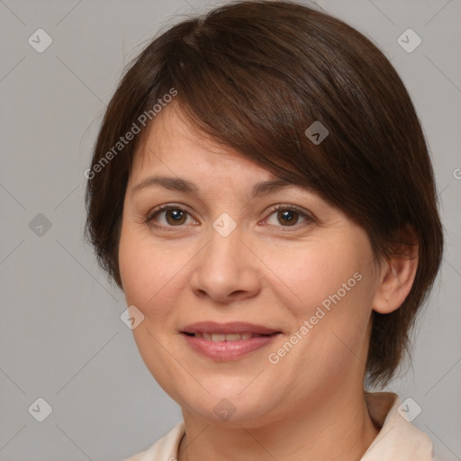 Joyful white adult female with medium  brown hair and brown eyes