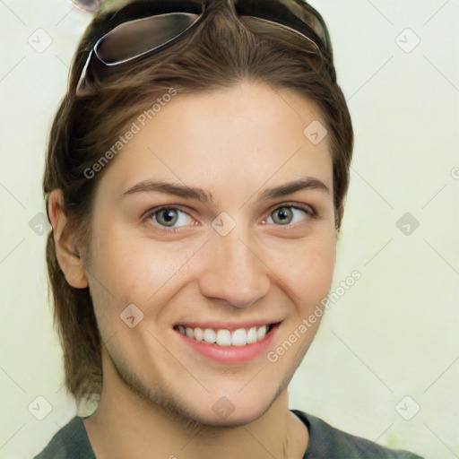 Joyful white young-adult female with medium  brown hair and green eyes