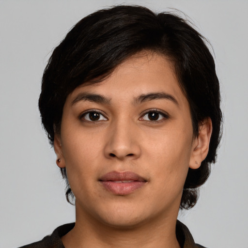 Joyful asian young-adult female with medium  black hair and brown eyes