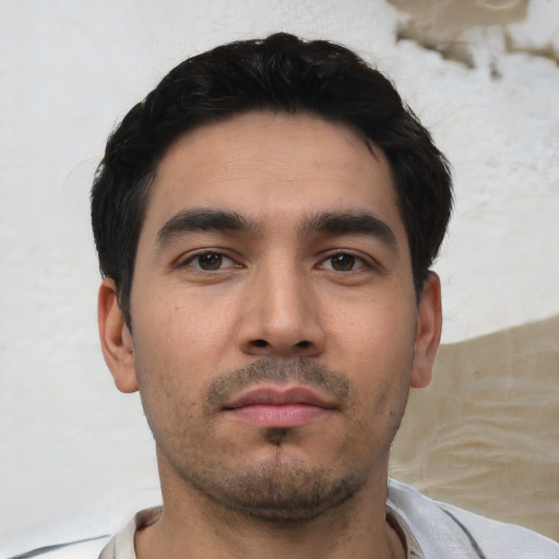 Neutral white young-adult male with short  black hair and brown eyes
