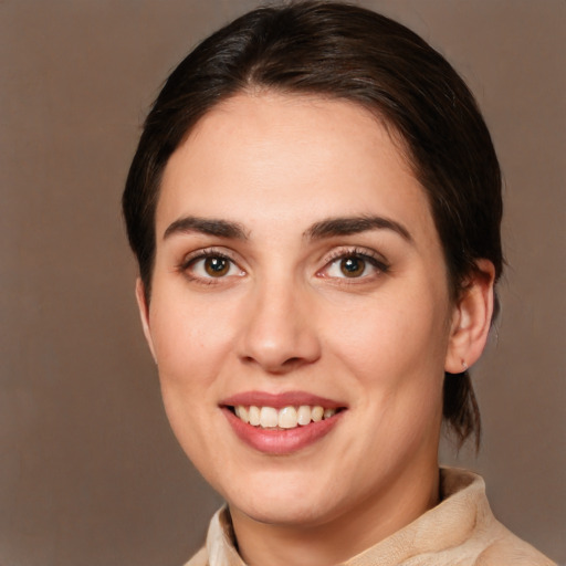 Joyful white young-adult female with medium  brown hair and brown eyes