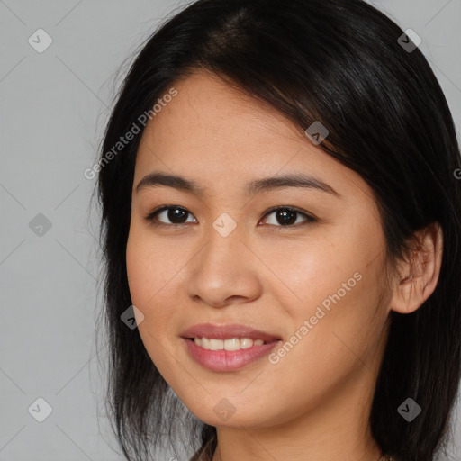 Joyful asian young-adult female with long  brown hair and brown eyes