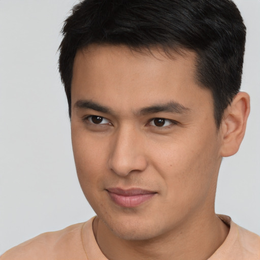 Joyful asian young-adult male with short  brown hair and brown eyes
