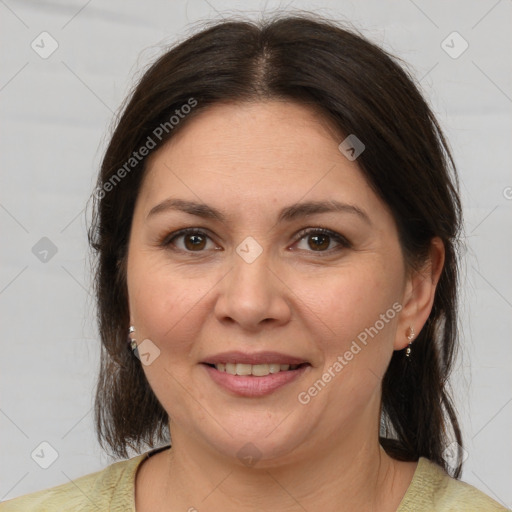 Joyful white adult female with medium  brown hair and brown eyes