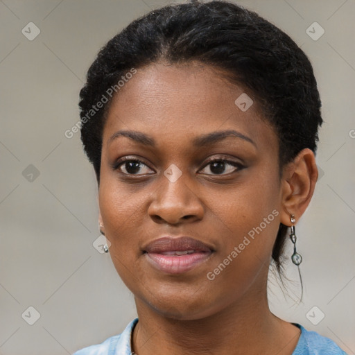 Joyful black young-adult female with short  black hair and brown eyes