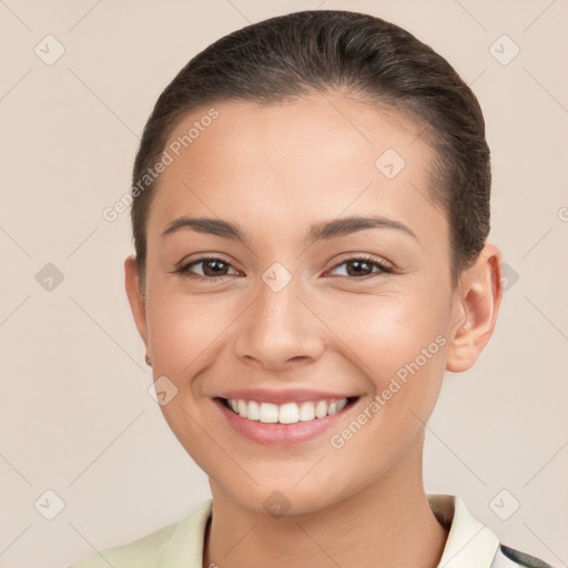 Joyful white young-adult female with short  brown hair and brown eyes