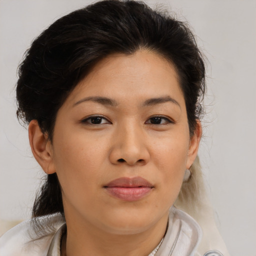 Joyful asian young-adult female with medium  brown hair and brown eyes