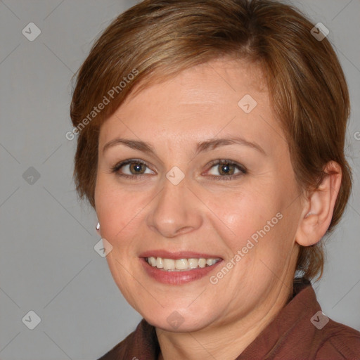 Joyful white adult female with medium  brown hair and brown eyes