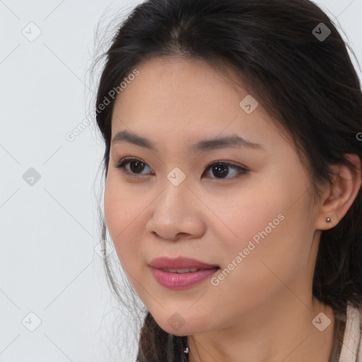 Joyful asian young-adult female with long  brown hair and brown eyes