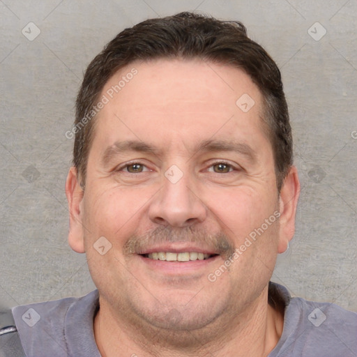 Joyful white adult male with short  brown hair and grey eyes