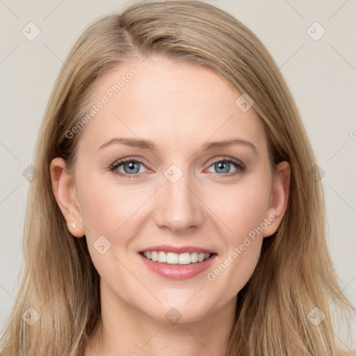 Joyful white young-adult female with long  brown hair and blue eyes