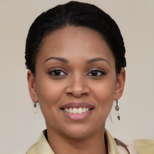 Joyful latino young-adult female with short  brown hair and brown eyes