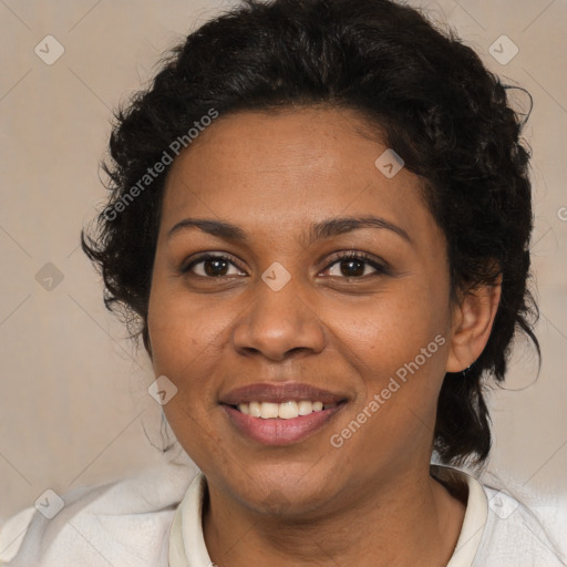 Joyful black adult female with medium  brown hair and brown eyes