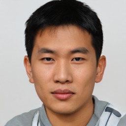 Neutral asian young-adult male with short  brown hair and brown eyes