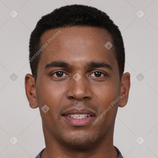 Joyful black young-adult male with short  black hair and brown eyes