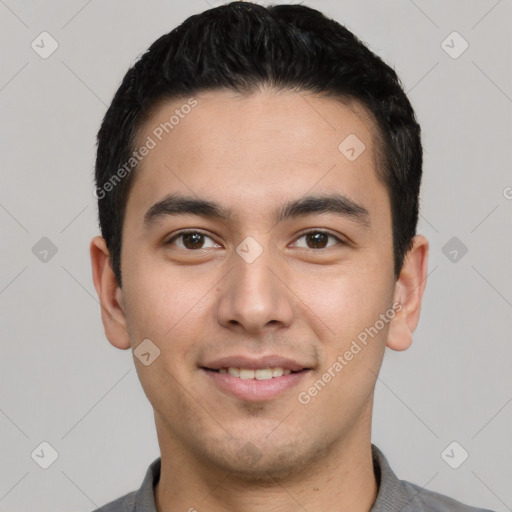 Joyful latino young-adult male with short  black hair and brown eyes