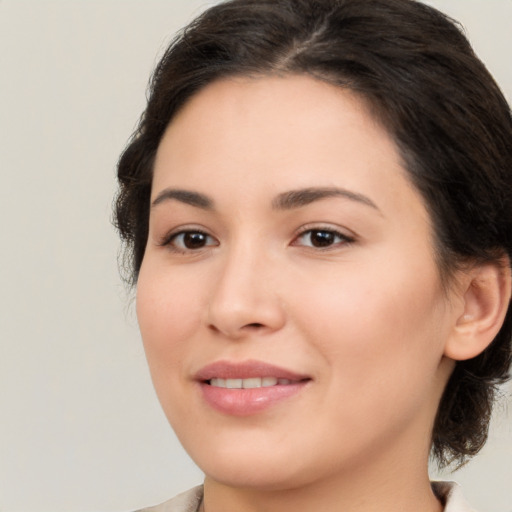 Joyful white young-adult female with medium  brown hair and brown eyes