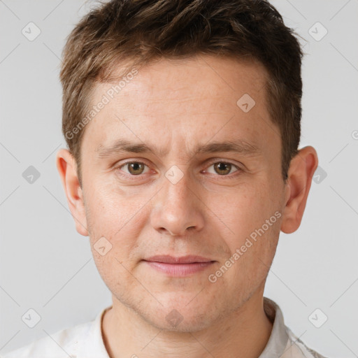 Joyful white adult male with short  brown hair and brown eyes