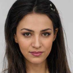 Joyful white young-adult female with long  brown hair and brown eyes