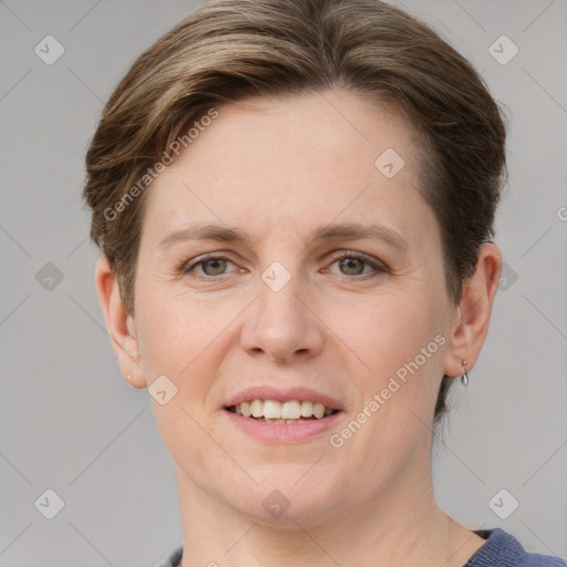 Joyful white young-adult female with short  brown hair and grey eyes