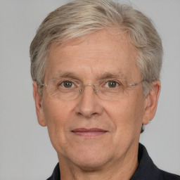 Neutral white middle-aged male with short  gray hair and brown eyes