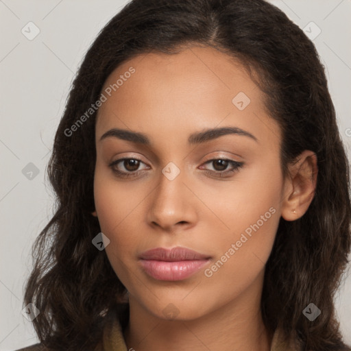 Joyful latino young-adult female with long  brown hair and brown eyes