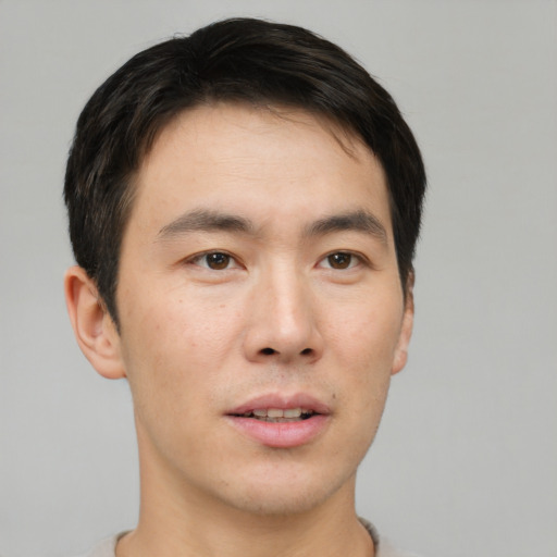 Neutral asian young-adult male with short  brown hair and brown eyes