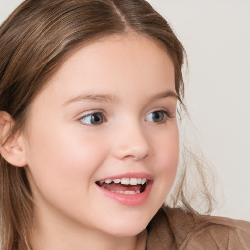 Joyful white child female with long  brown hair and brown eyes