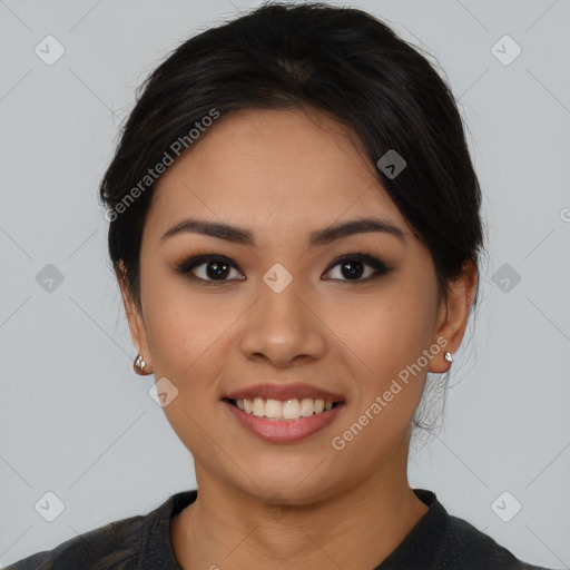 Joyful asian young-adult female with medium  black hair and brown eyes