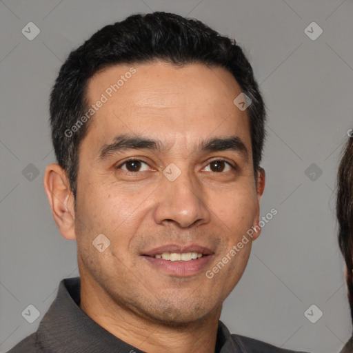 Joyful white adult male with short  black hair and brown eyes