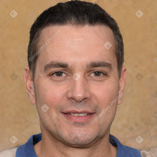 Joyful white adult male with short  brown hair and brown eyes