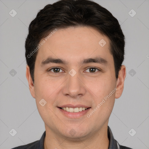 Joyful white young-adult male with short  black hair and brown eyes