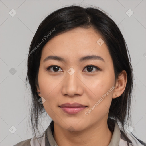 Joyful latino young-adult female with medium  black hair and brown eyes