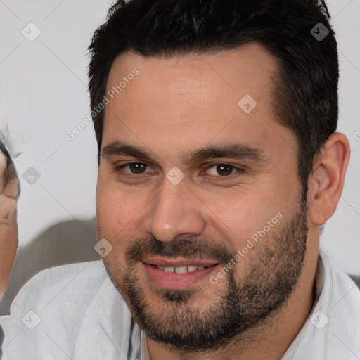 Joyful white young-adult male with short  brown hair and brown eyes