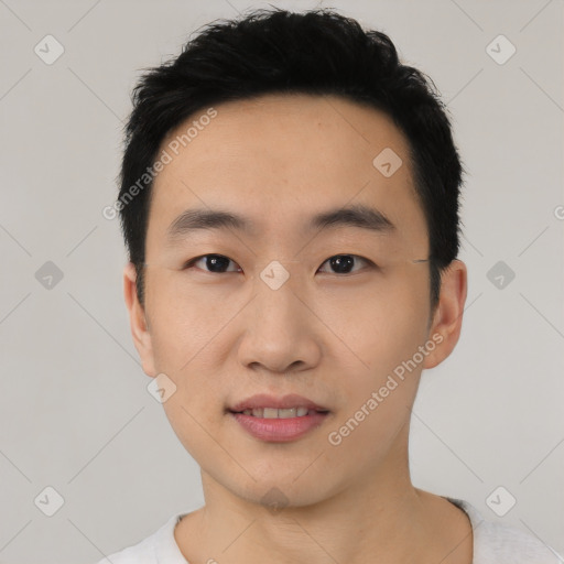 Joyful asian young-adult male with short  black hair and brown eyes