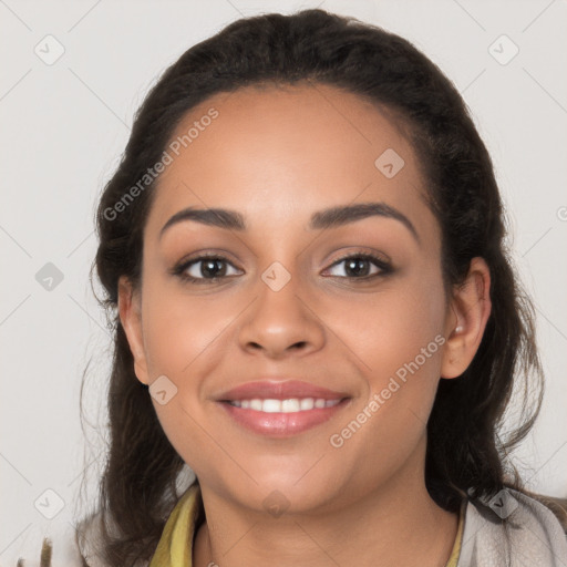 Joyful latino young-adult female with long  brown hair and brown eyes