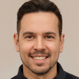 Joyful white young-adult male with short  brown hair and brown eyes