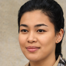 Joyful asian young-adult female with medium  brown hair and brown eyes