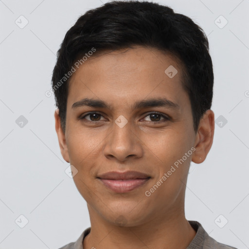 Joyful latino young-adult male with short  brown hair and brown eyes