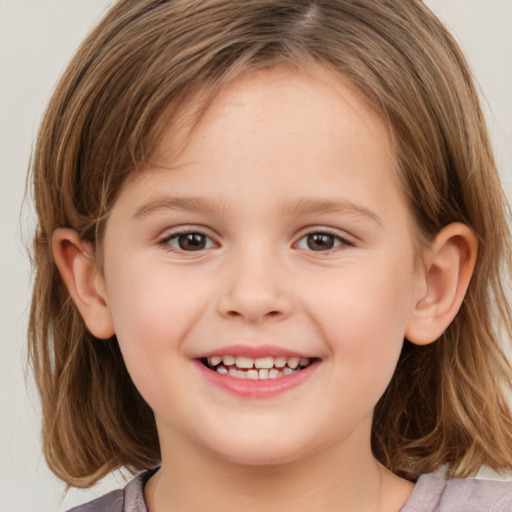 Joyful white child female with medium  brown hair and brown eyes