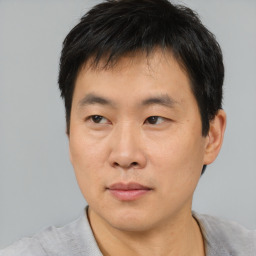 Neutral asian young-adult male with short  brown hair and brown eyes