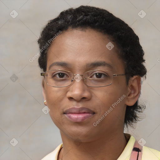 Joyful black adult female with short  brown hair and brown eyes