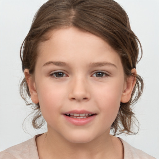 Joyful white child female with medium  brown hair and brown eyes