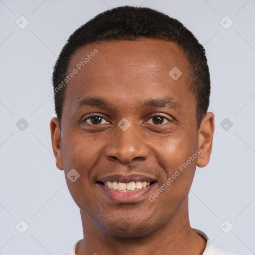 Joyful black young-adult male with short  black hair and brown eyes