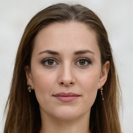 Joyful white young-adult female with long  brown hair and green eyes