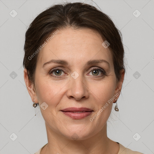 Joyful white adult female with medium  brown hair and grey eyes