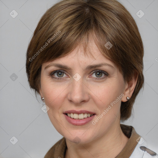 Joyful white adult female with medium  brown hair and grey eyes