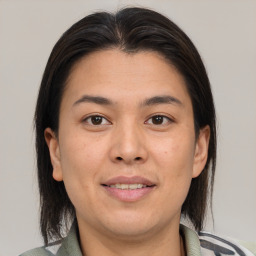 Joyful white adult female with medium  brown hair and brown eyes