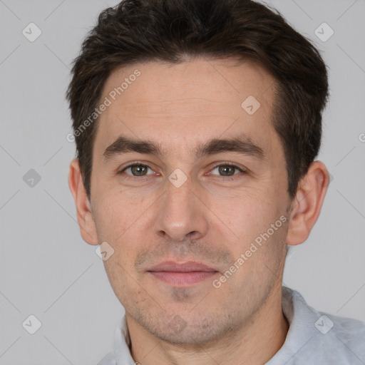 Joyful white adult male with short  brown hair and brown eyes